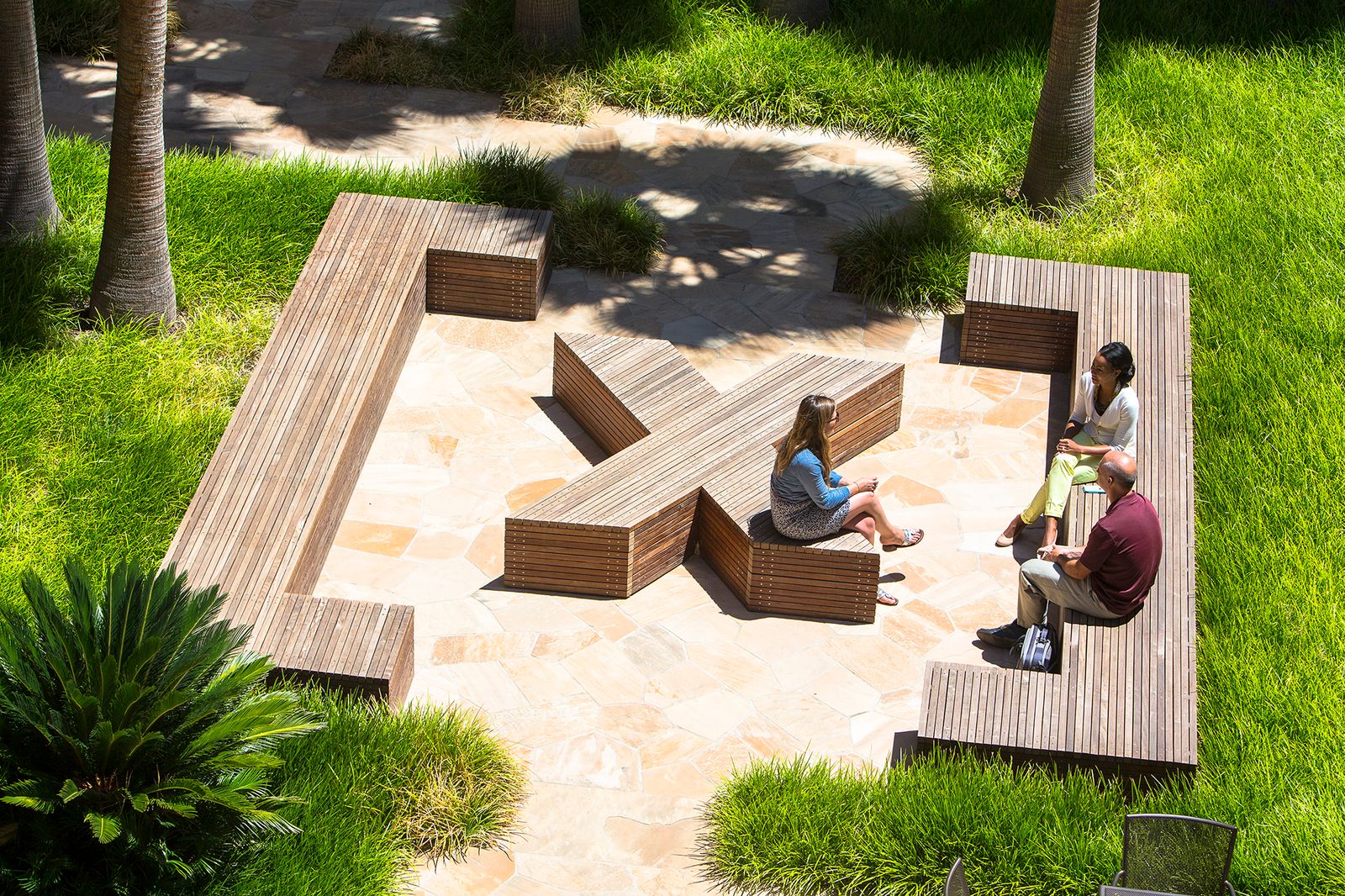 Benches in the shape of an X, a Y, and enclosing brackets