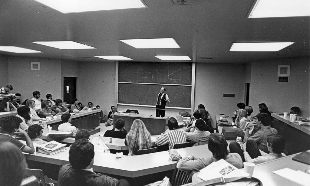 Black and white photo of David Harris lecturing in 1976